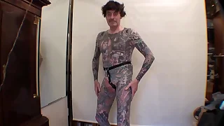 Tattoo Boy LeeHarper Pinnomen Show Off With a Borrowed Fancy Tight Beltstrap used in the Male Stripshow Production - Two Rings are Attached to the Strap - Enabling a Stripper With a P/A to Suspend His Penis Almost Resembling the Look of Aboriginals in